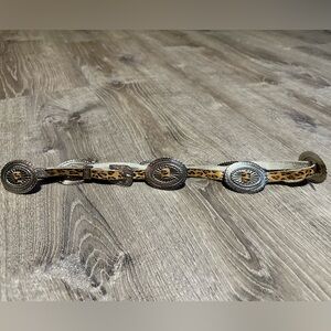 Faux leather (cheetah) with metal pieces and buckle